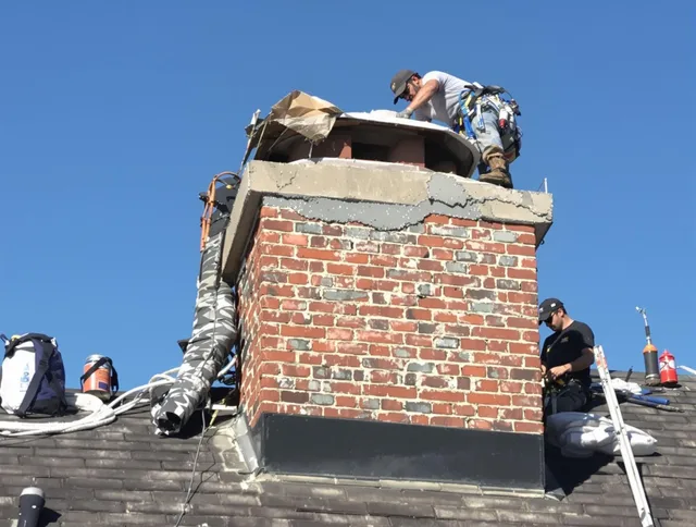 Newington Chimney Sweep installing a custom chimney crown in Newington, CT