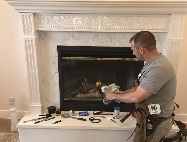 Newington Chimney Sweep performing fireplace maintenance in Newington, CT