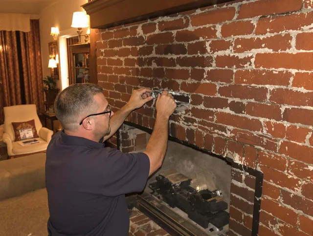 Newington Chimney Sweep expert fixing a fireplace in Newington, CT